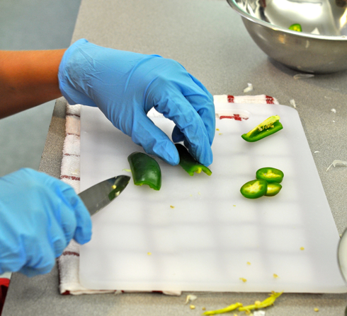 chopping jalapeño peppers