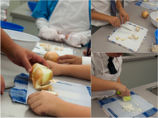 Kids chopping onions and garlic with Rossy Earle on eatlivetravelwrite.com