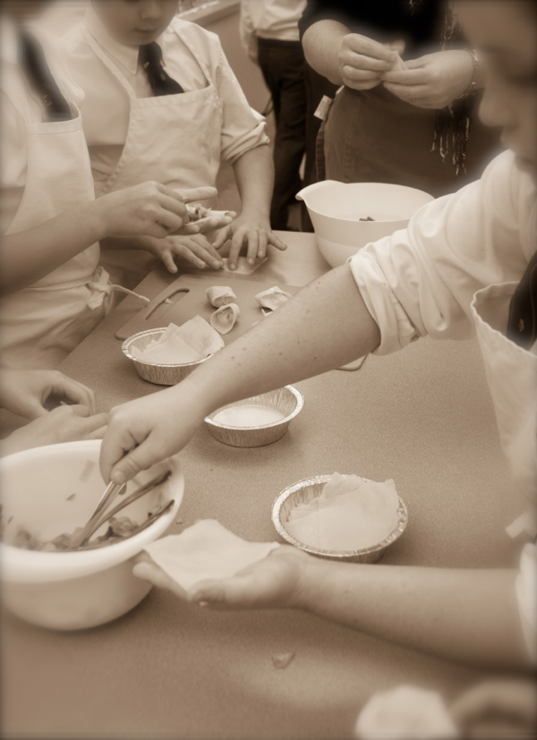 Kids filling Afghan dumplings on eatlivetravelwrite.com