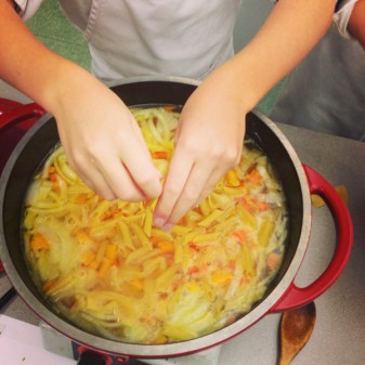 Crumbling pasta into happy frumpy minestrone #savewithJamie on eatlivetravelwrite.com
