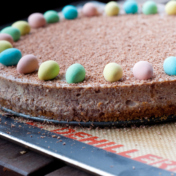 Baked chocolate cheesecake decorated for Easter on eatlivetravelwrite.com