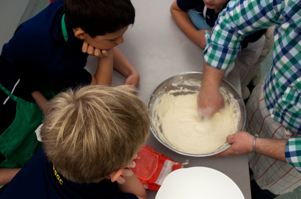 Massimo Bruno showing kids how to make pizza dough on eatlivetravelwrite.com