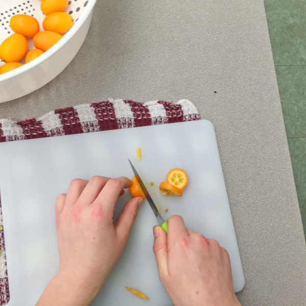 Kids in the kitchen with kumquats on eatlivetravelwrite.com