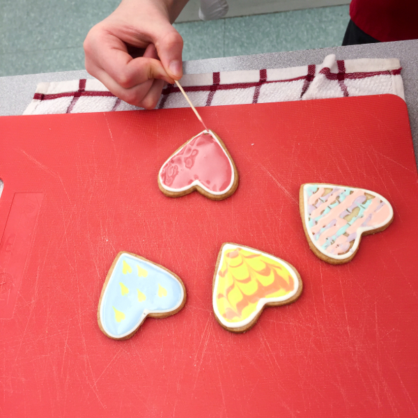 Kids flooding cookies with icing on eatlivetravelwrite.com