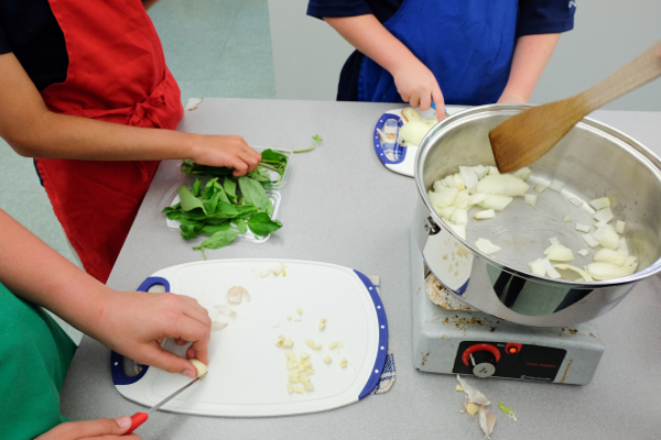 Kids chopping garlic, onions and basil on eatlivetravelwrite.com