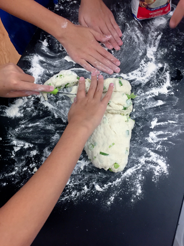 Kids making green onion pancakes on eatlivetravelwrite.com