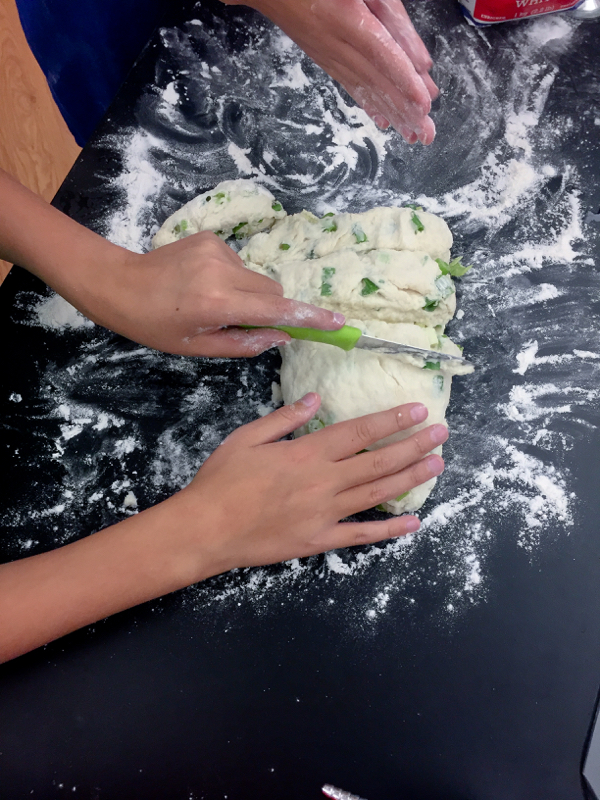 Kids dividing scallion pancake mix up on eatlivetravelwrite.com