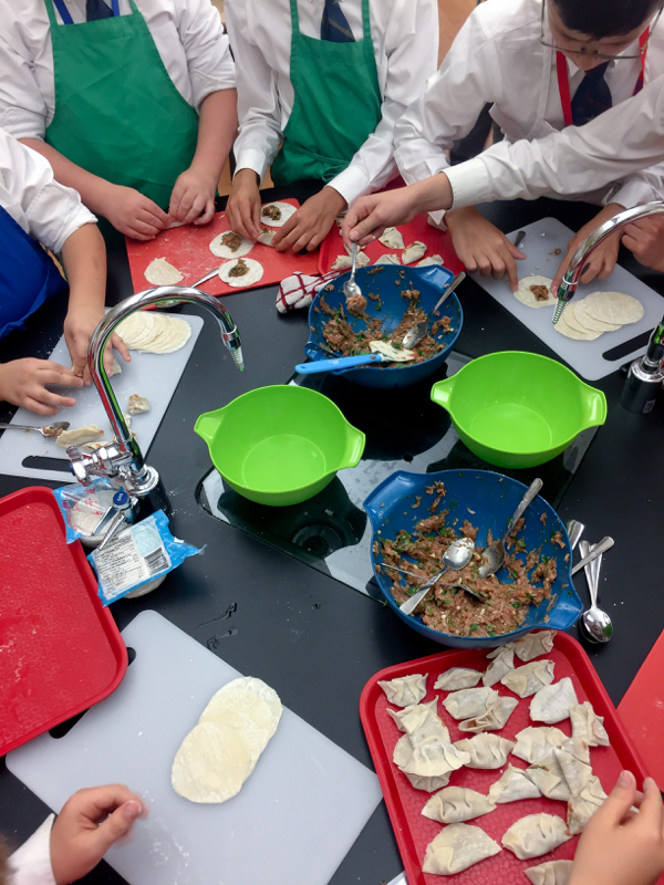Kids forming chicken dumplings on eatlivetravelwrite.com