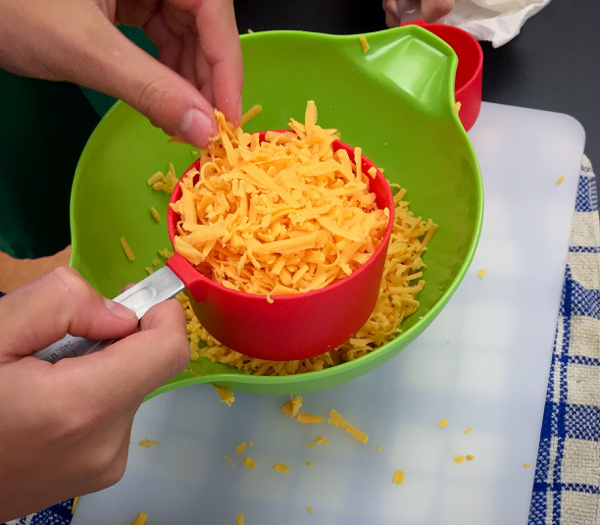 Grated cheese for gougeres on eatlivetravelwrite.com