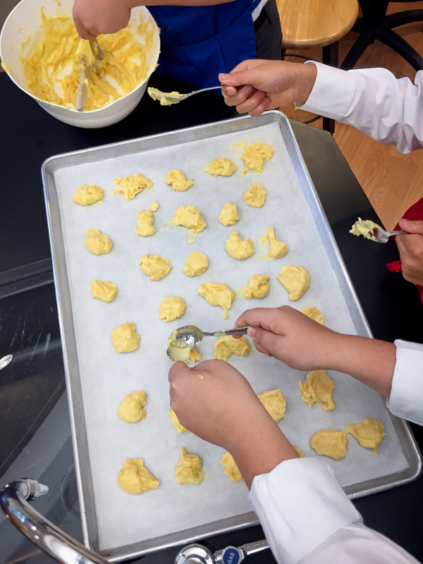 Kids making gougeres for a cocktail reception on eatlivetravelwrite.com
