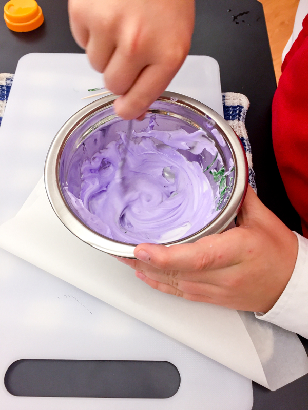 Mixing purple icing for decorating cookies o on eatlivetravelwrite.com