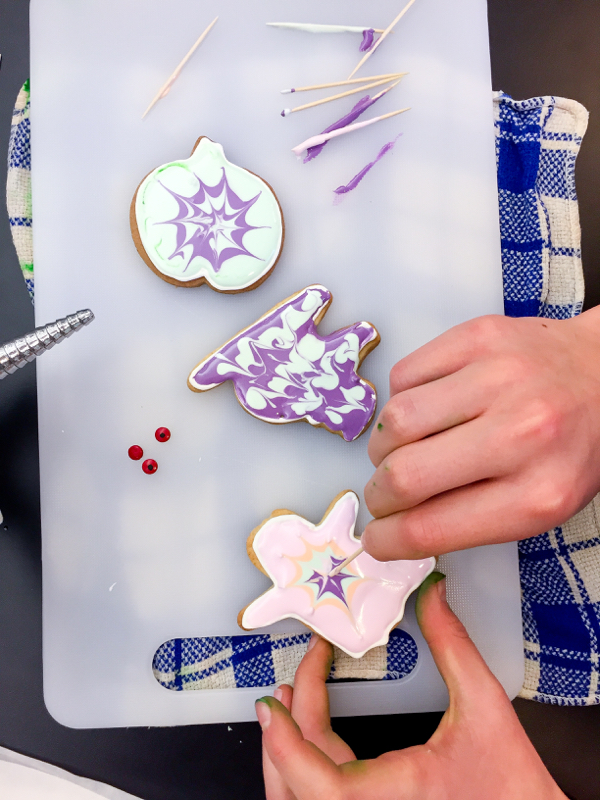 Kids decorating Halloween cookies on eatlivetravelwrite.com