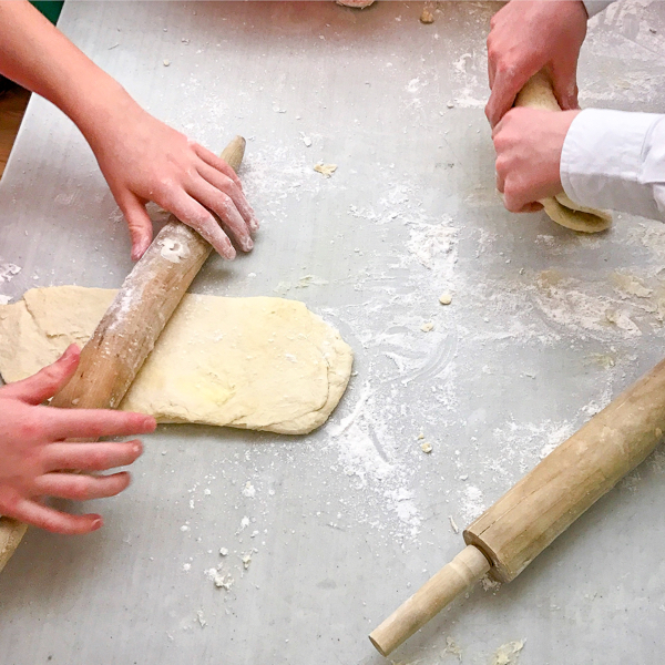 Rolling and turning rough puff pastry with kids image on eatlivetravelwrite.com