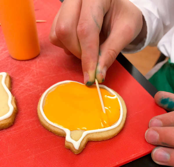 Flooding pumpkin cookies with Adell Shneer on eatlivetravelwrite.com