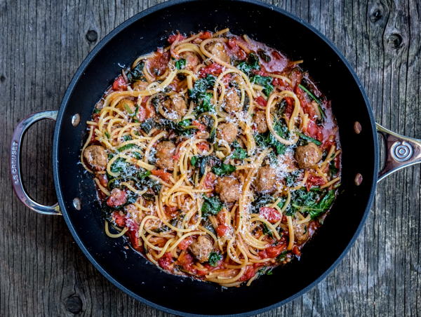 One pot pasta made in Le Creuset Toughened Non Stick Deep Frying Pan with meatballs tomatoes and kale on eatlivetravelwrite.com