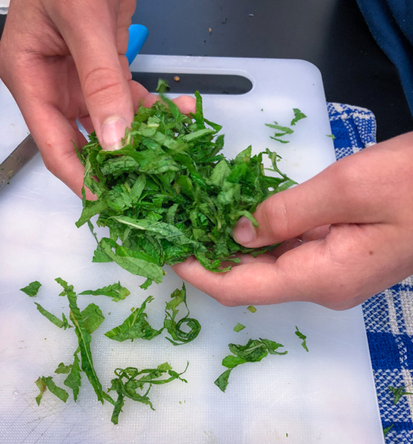 Chiffonaded basil to make Persian watermelon salad on eatlivetravelwrite.com