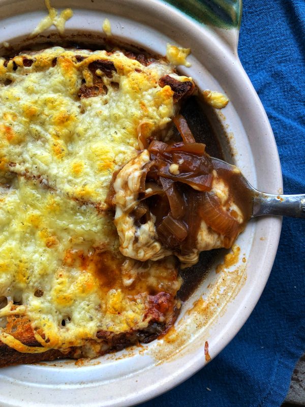 A spoon of David Lebovtiz French onion soup from My Paris Kitchen on eatlivetravelwrite.com
