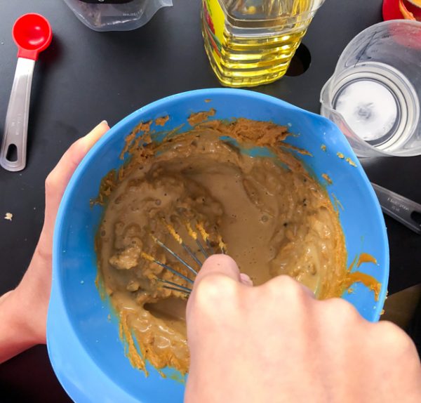 Kids making Wow butter dressing for Chopped Thai Salad from Modern Lunch by Allison Day on eatlivetravelwrite.com