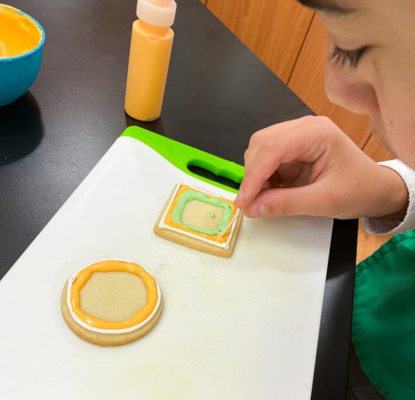 Careful flooding work decorating sugar cookies with Adell Shneer on eatlivetravelwrite.com