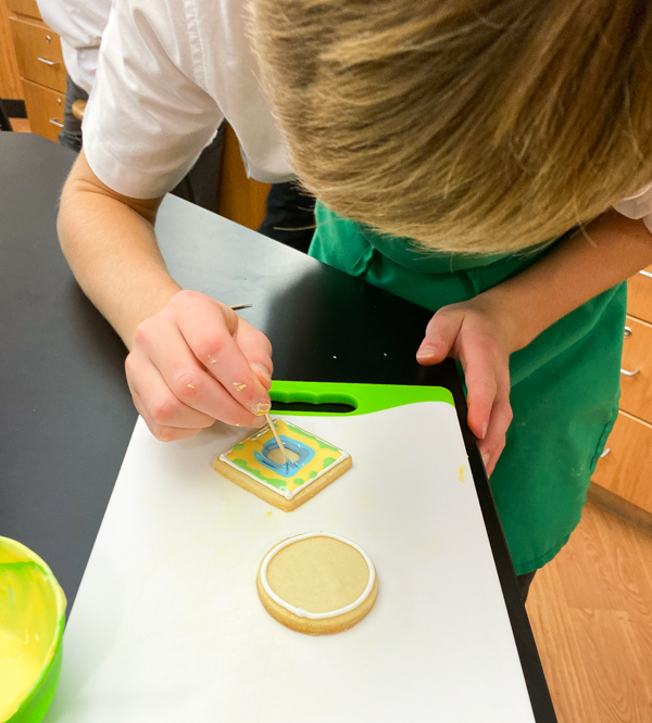 Extreme focus when decorating sugar cookies with Adell Shneer on eatlivetravelwrite.com