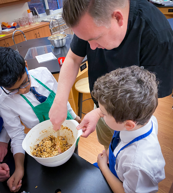 Kids making Pumpkin Spice Granola Bars from Gather by David Robertson on eatlivetravelwrite.com