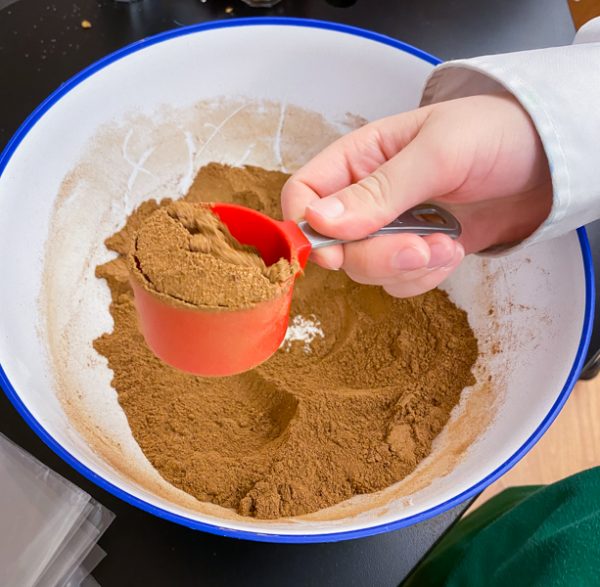 Kids making homemade Pumpkin Pie Spice from Gather by David Robertson on eatlivetravelwrite.com
