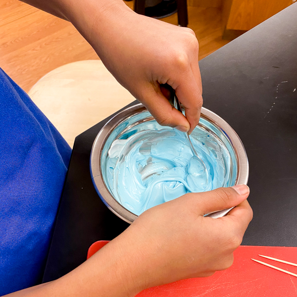 Mixing royal icing for decorating sugar cookies with Adell Shneer on eatalivetravelwrite.com