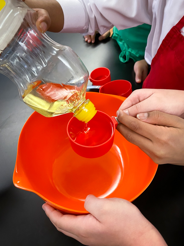 Measuring oil to make from Peace, Love and Fibre by Mairlyn Smith on eatlivetravelwrite.com