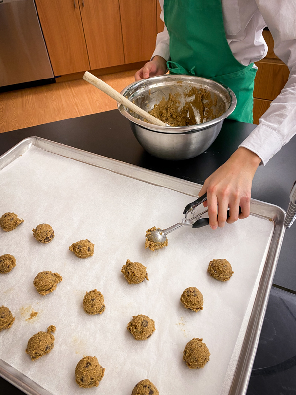 Kids scooping cookies to make treats from Peace, Love and Fibre by Mairlyn Smith on eatlivetravelwrite.com
