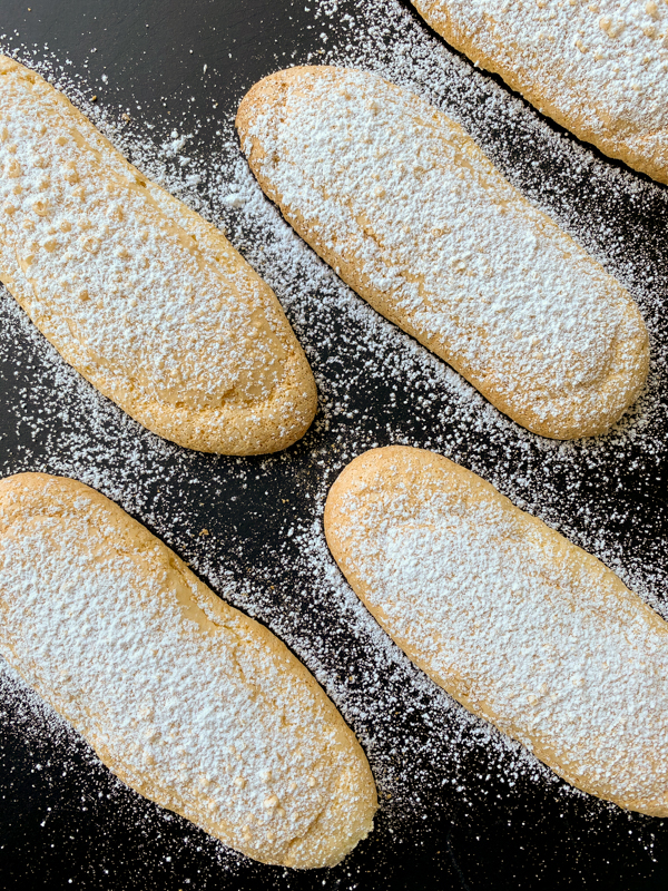 Ladyfinger biscuits on a black slate
