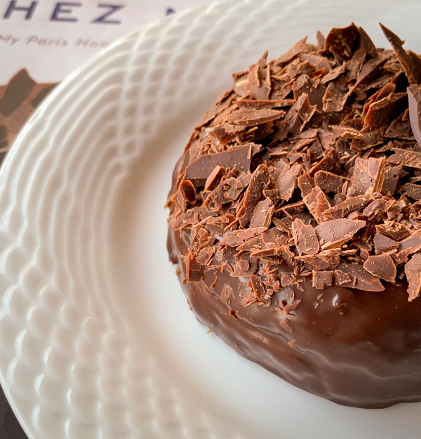 Tiny version of Dorie Greenspan's Carrement Chocolate Cake on a white plate
