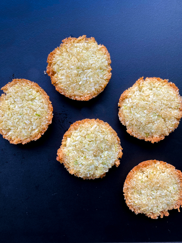 Coconut Patties from Dorie's Cookies on a dark blye serving plate.