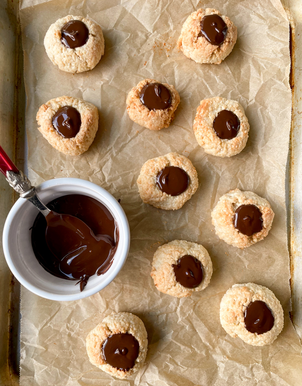 Dorie Greenspan's Coco-Almond Thumbprints from Dorie's Cookies on a baking tray.