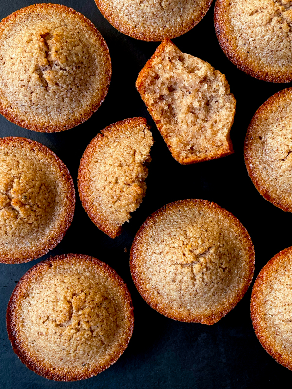 Speculoos financiers on a black plate showing interior.