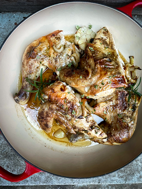 Dorie Greenspan's Spatchcocked Chicken from Everyday Dorie in a shallow roasting pan.