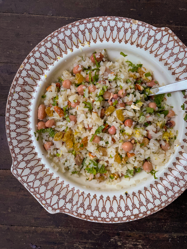 Dorie Greenspan's Cauilflower Tabbouleh from Everyday Dorie in a bowl with a spoon.