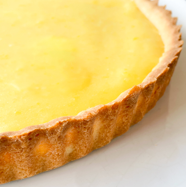 A close up of the crust of Dorie Greenspan French Riviera Lemon Tart.