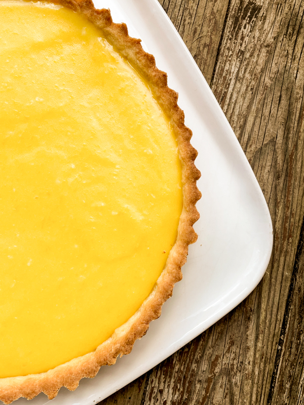 Dorie Greenspan French Riviera Lemon Tart on a white plate.