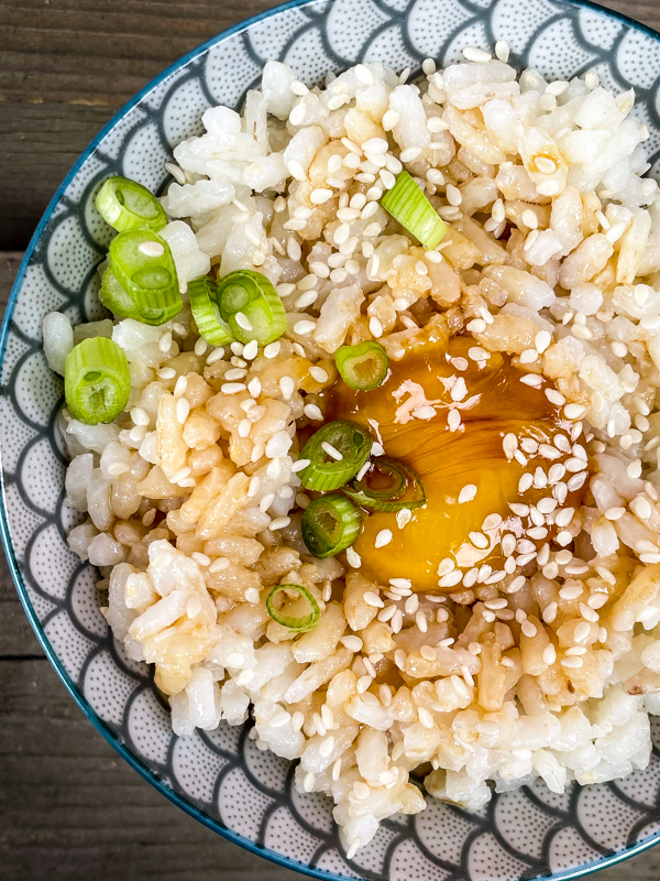 Soy-Sauce Eggs and Sticky Rice from Everyday Dorie in a small bowl topped with sesame seeds and green onions.