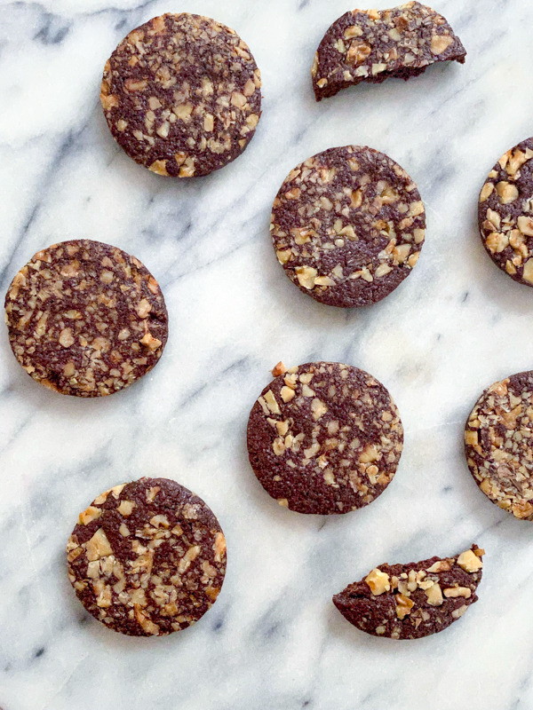 Dorie Greenspan's Chocolate-Pecan Cookies on a marble countertop.
