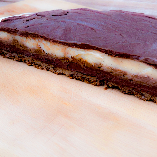 S’mores Ice Cream Cake from Baking with Dorie, cut crossways on a cutting board.