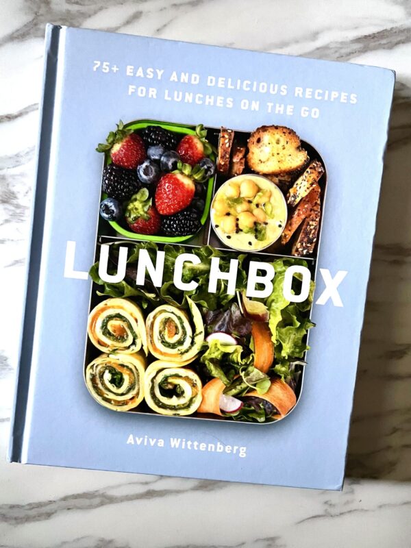 Aviva Wittenberg's Lunchbox cookbook on a marble background.