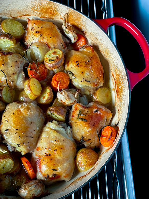 Roast Chicken with Pan-Sauce Vinaigrette in a cast iron roaster.