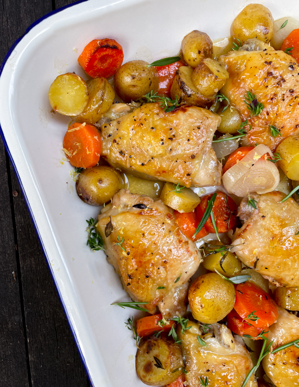 Roast Chicken with Pan-Sauce Vinaigrette in a white and blue enamel dish.