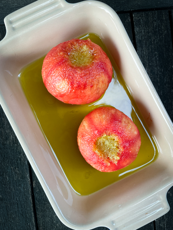 Giverny Tomatoes from Everyday Dorie in a pool of olive oil in a baking dish.