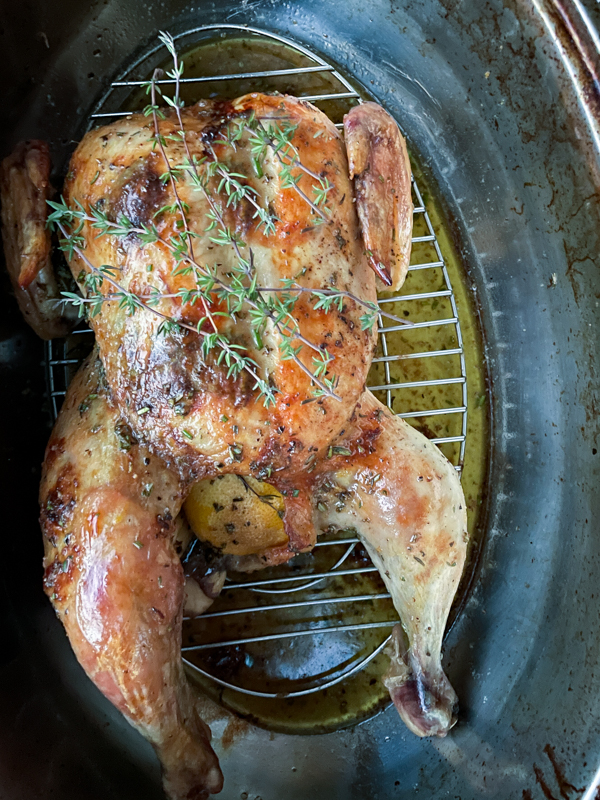 Dorie Greenspan's Herb Butter Chicken in a roasting pan.