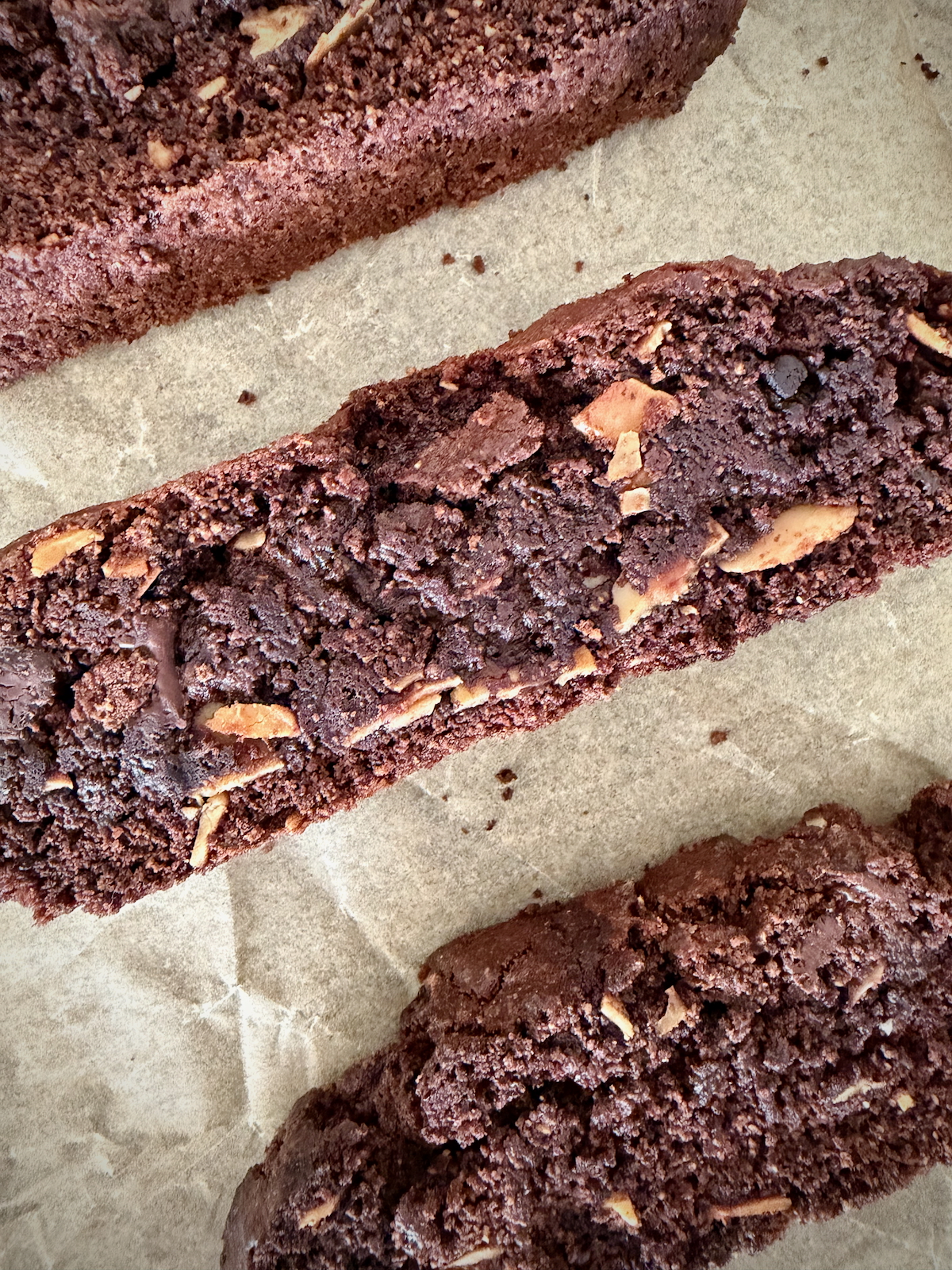 Tuesdays with Dorie: Cocoa-Cornmeal Biscotti from Baking with Dorie on a parchment-lined baking sheet.