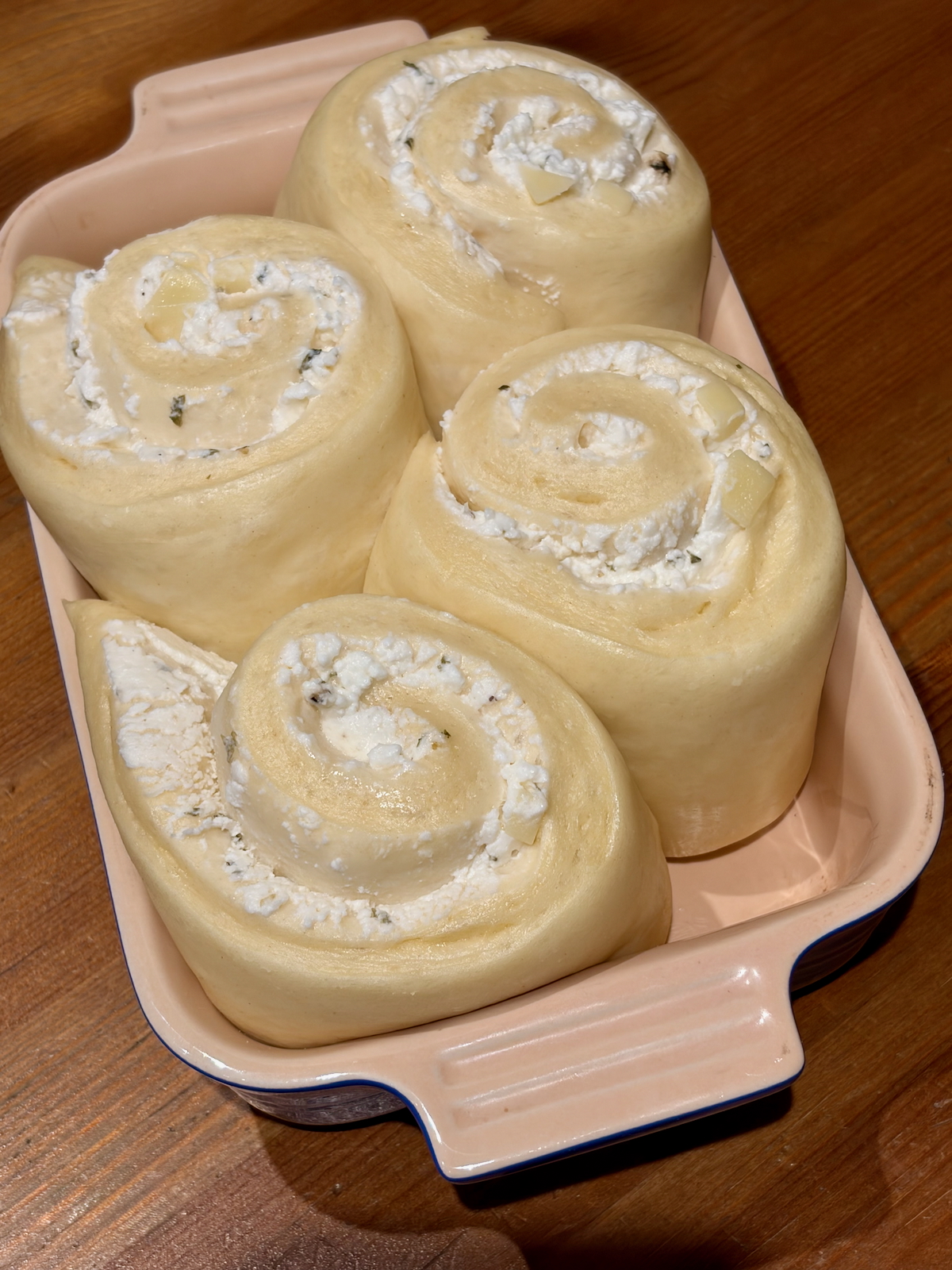 Cheese-Swirl Babka Buns from Baking with Dorie proofing in a baking dish.